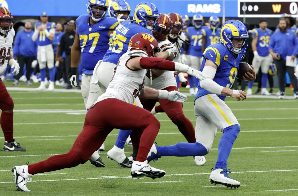 Matthew Stafford (9) of the Los Angeles Rams carries the ball during the first half of the game against the Washington Commanders in Inglewood, Calif., on Dec. 17, 2023. (Kevork Djansezian/Getty Images)
