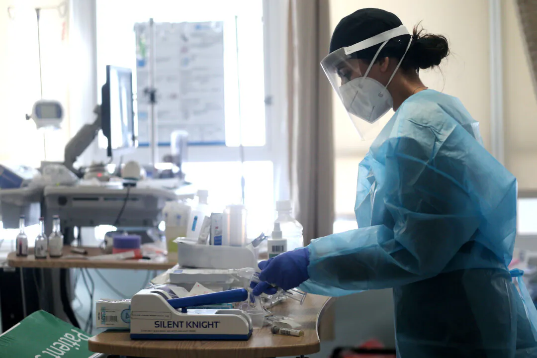 A registered nurse cares for COVID-19 patients in a makeshift ICU (Intensive Care Unit) at Harbor-UCLA Medical Center in Torrance, Calif., on Jan. 21, 2021. (Mario Tama/Getty Images)