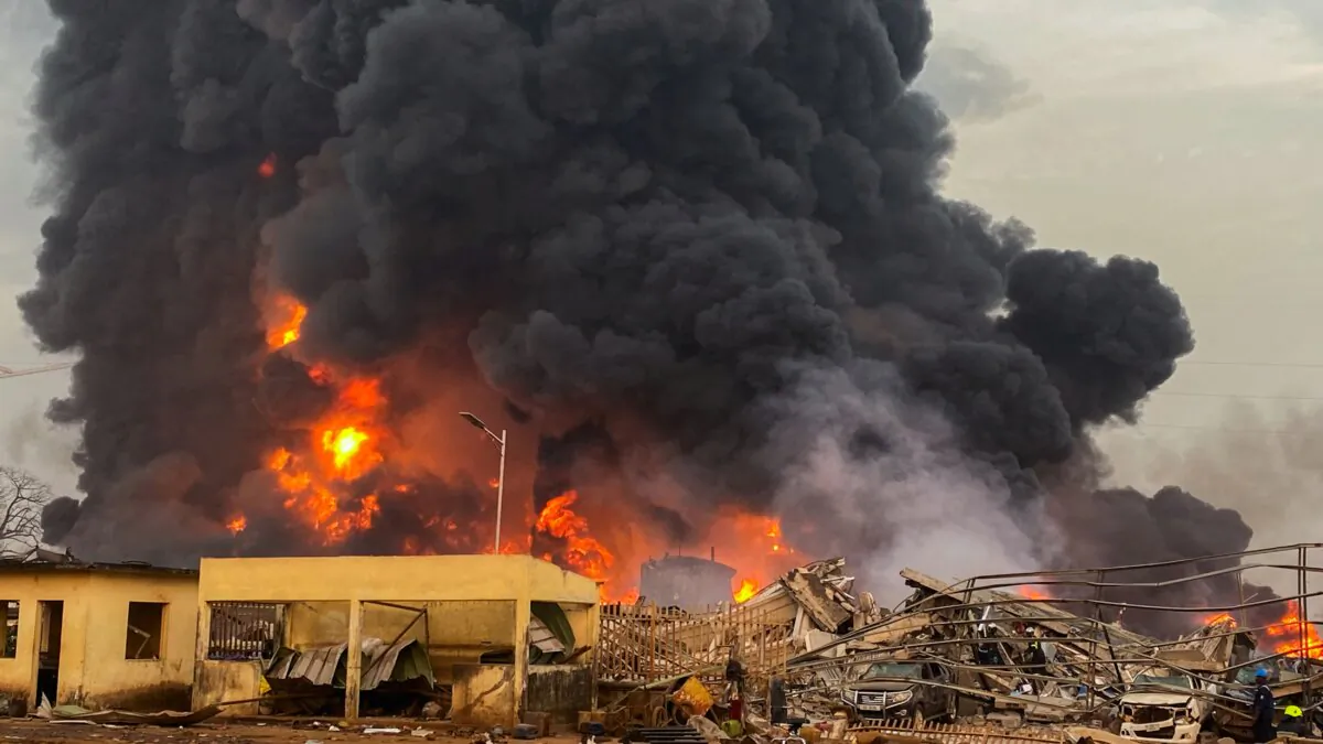 Fire burns after a blast at an oil terminal in Conakry, Guinea, on Dec. 18, 2023. (Souleymane Camara/Reuters)