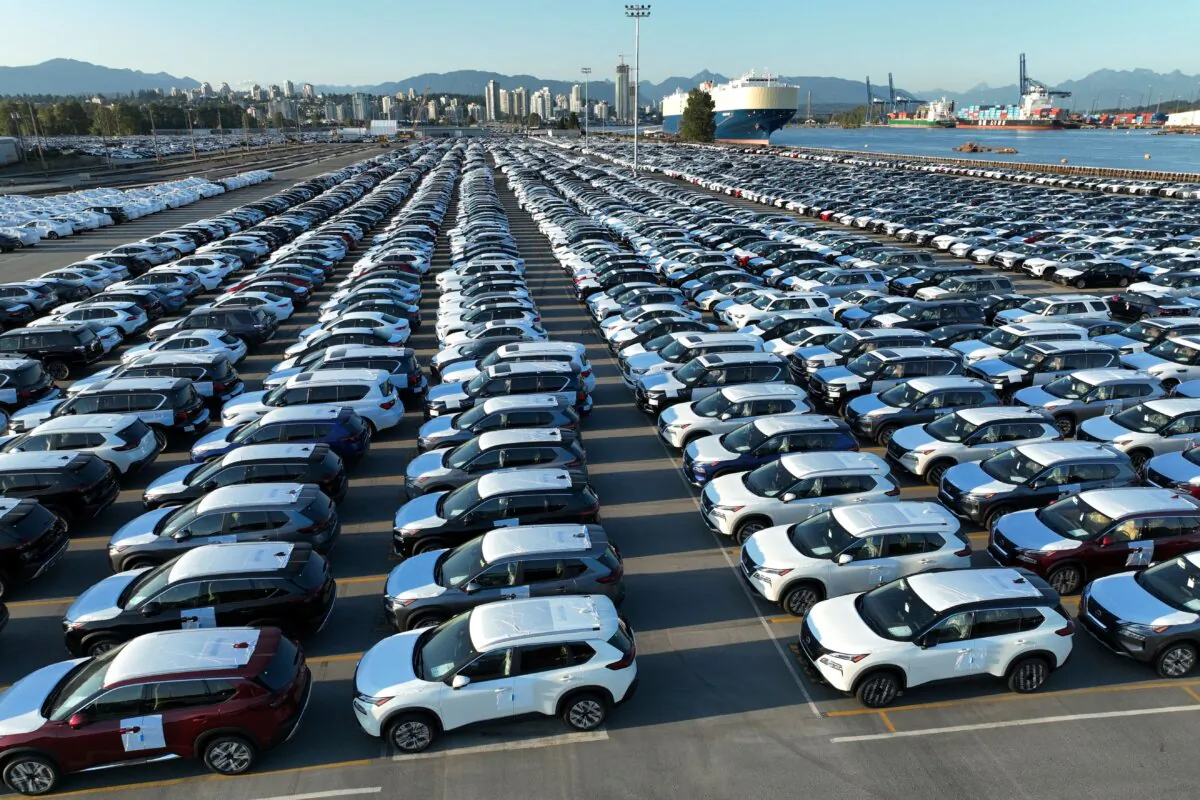 New cars are parked in rows after arriving by ship at Annacis Island in Delta, British Columbia, Canada, on July 31, 2023. (Reuters/Chris Helgren)