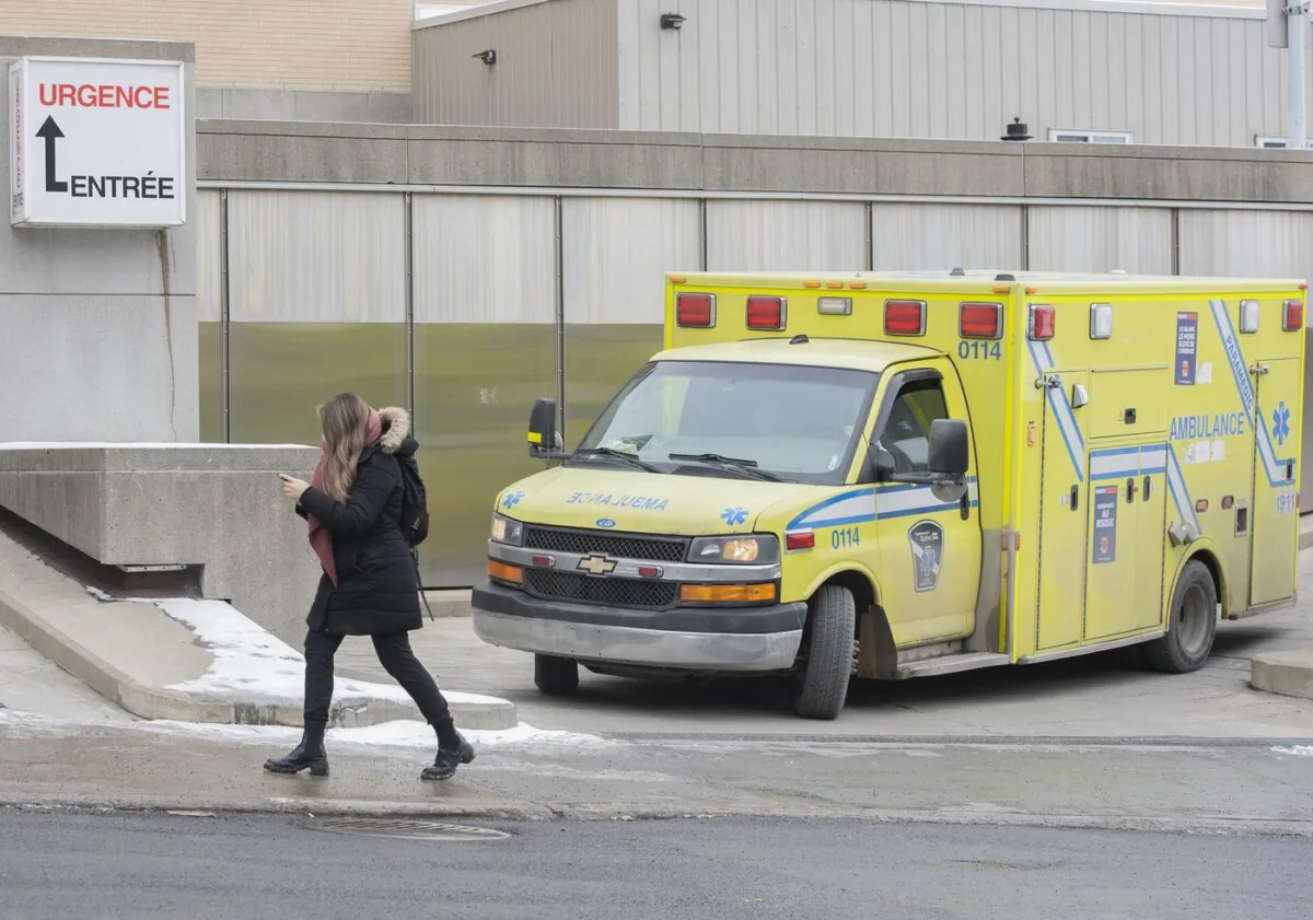 An ambulance pulls out of the emergency entrance of a hospital in Montreal, on Dec. 29, 2021. (The Canadian Press/Graham Hughes)