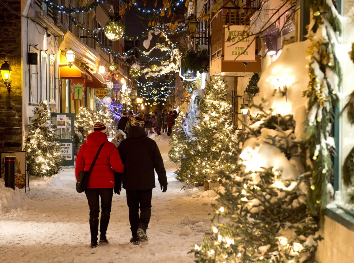 Tourists walk the Quartier Petit Champlain as Christmas lights illuminate the old historic Quebec City in a file photo.  (The Canadian Press/Jacques Boissinot)