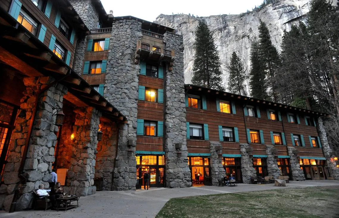 The historic Ahwahnee Hotel lit up as dusk falls over Yosemite Valley. (John Walker/Fresno Bee/TNS)