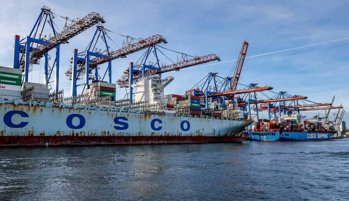Cosco shipping corporation's container ships Cosco Pride (L) and Xin Lian Yun Gang are unloaded at the Tollerort Container Terminal, in the harbor of Hamburg, Germany, on Oct. 26, 2022. (Photo by Axel Heimken / AFP via Getty Images)