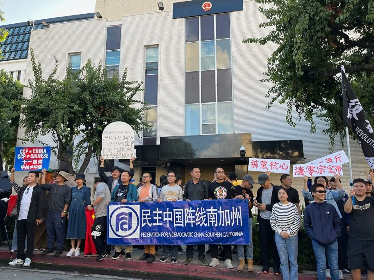 Zheng Min (the third from right in the front row) protests along with pro-democracy Chinese dissidents in front of the Chinese consulate in Los Angeles on Oct. 1, 2023. (Courtesy of Zheng Min)