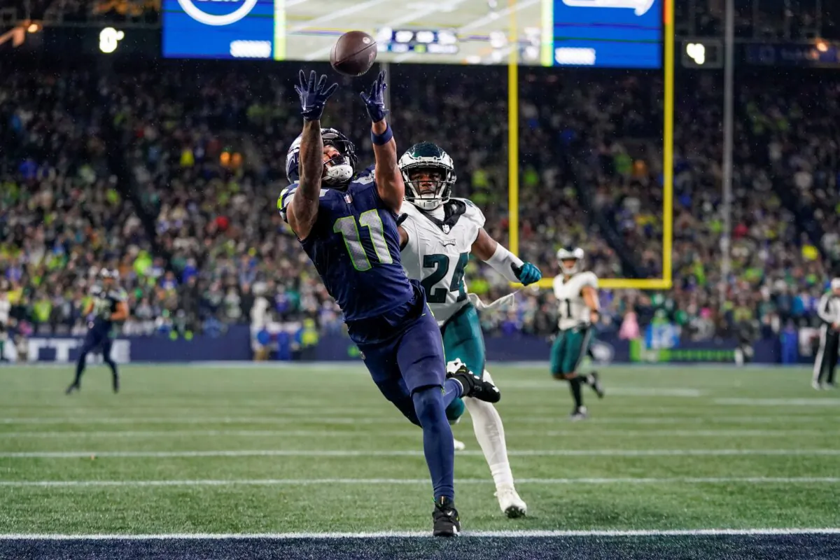 Seattle Seahawks wide receiver Jaxon Smith-Njigba (11) makes a touchdown catch in front of Philadelphia Eagles cornerback James Bradberry (24) during the second half of an NFL football game in Seattle on Dec. 18, 2023. (AP Photo/Lindsey Wasson)