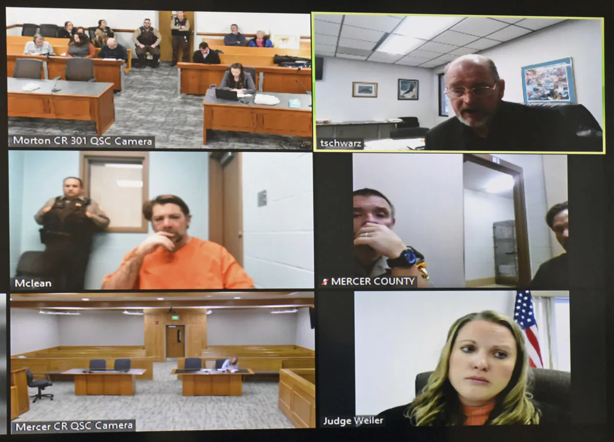 In this frame grab from video, Ian Cramer, (Center L), makes his initial court appearance via a video link from from the McLean County jail in Washburn, N.D., on Dec. 8, 2023. (Tom Stromme/The Bismarck Tribune via AP)