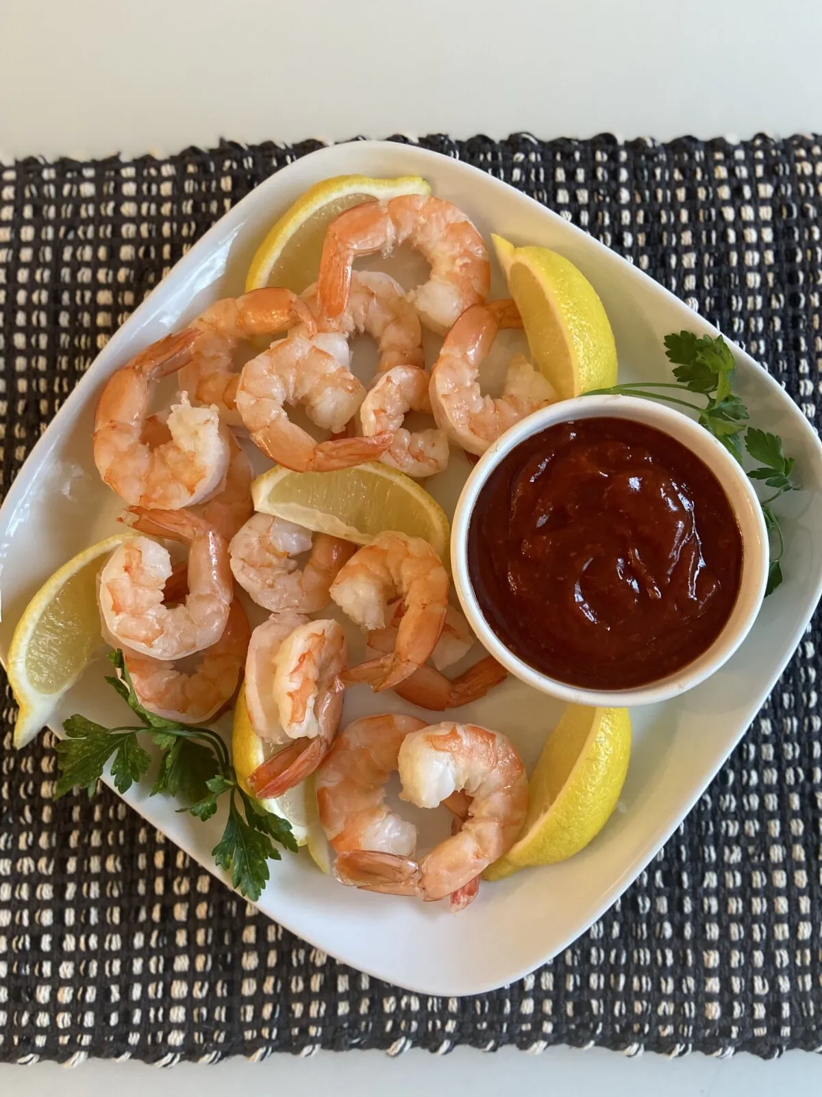 Cooking shrimp in the shell yields more flavor in the cooked product; peeled, deveined shrimp proves more convenient for the cook. (JeanMarie Brownson/TNS)
