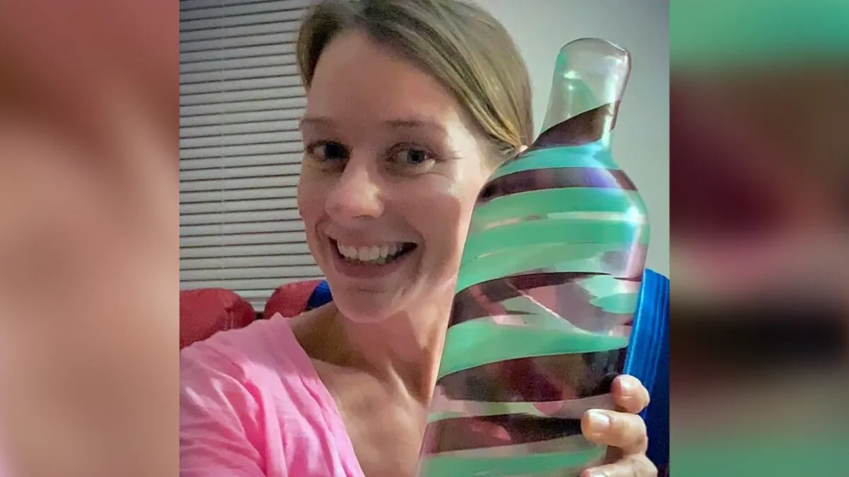 Jessica Vincent holding a vase by Italian architect and designer Carlo Scarpa at her home in Henrico County, Va. (Jessica Vincent via AP)