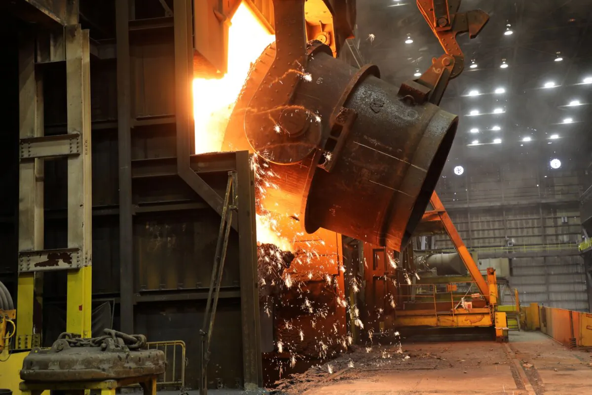A ladle of molten iron is poured into a Basic Oxygen Process (BOP) furnace at U. S. Steel's Granite City Works in Illinois, where it will be transformed into liquid steel. (Courtesy U.S. Steel)