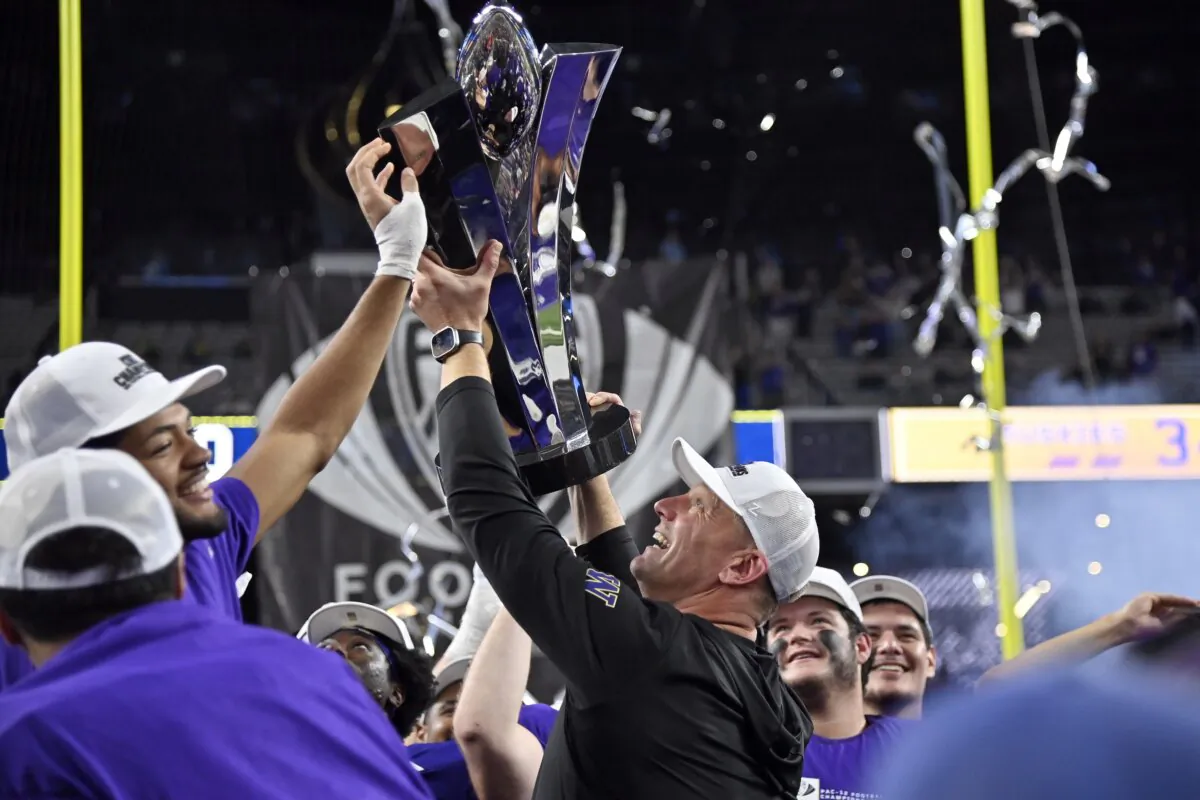 Washington coach Kalen DeBoer celebrates with the trophy after the team's win over Oregon in the Pac-12 championship NCAA college football game in Las Vegas on Dec. 1, 2023. (David Becker/AP Photo)