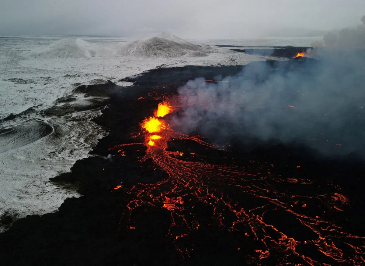 Lava spewed from the site of the volcanic eruption north of Grindavik, photographed from Sylingarfell, Iceland, on Dec 19, 2023. (Sigurdur Davidsson/Reuters)