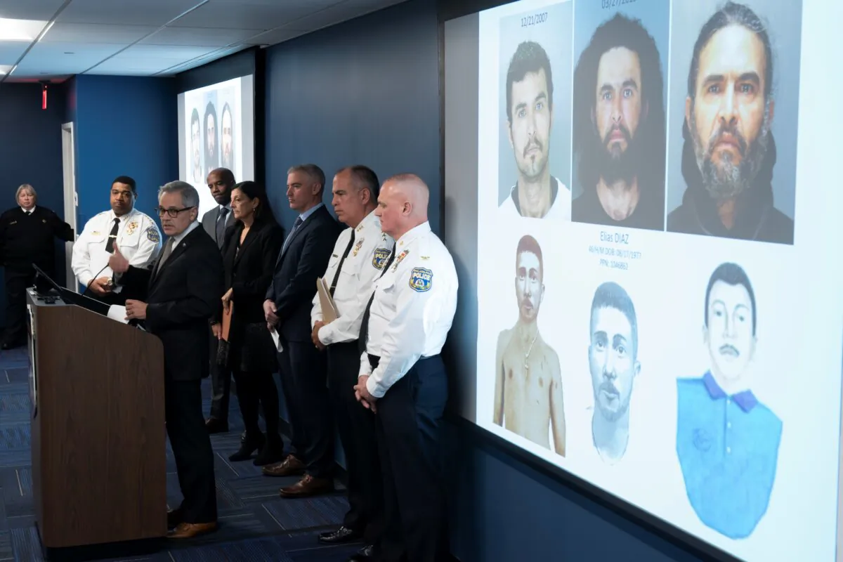 Philadelphia District Attorney Larry Krasner, at podium, speaks along side projected images of suspect Elias Diaz during a news conference in Philadelphia on Dec. 19, 2023. (Matt Rourke/AP Photo)