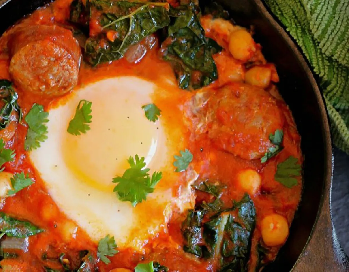 This recipe nudges the shakshouka into dinner territory with the hearty additions of chickpeas, wilted greens, and spicy sausage. (Lynda Balslev for Tastefood)