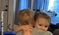 Baby Girl Comforts Baby Boy