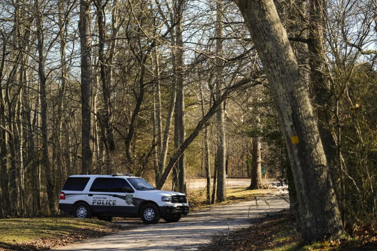 A police vehicle is parked on a road leading to the scene of a helicopter crash in Washington Township, N.J., on Dec. 20, 2023. (Matt Rourke/AP Photo)