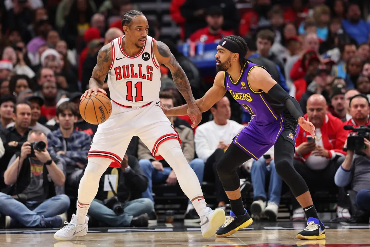 DeMar DeRozan (11) of the Chicago Bulls is defended by Gabe Vincent (7) of the Los Angeles Lakers during the first half in Chicago on Dec. 20, 2023. (Michael Reaves/Getty Images)
