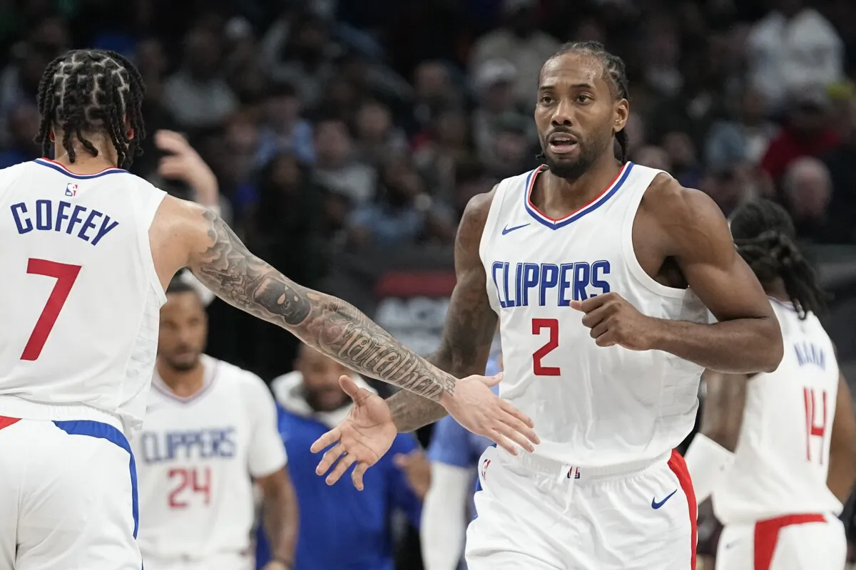 Los Angeles Clippers forward Kawhi Leonard (2) is congratulated by teammate guard Amir Coffey (7) after Leonard scored during the second half of an NBA basketball game against Dallas Mavericks in Dallas on Dec. 20, 2023. (LM Otero/AP Photo)