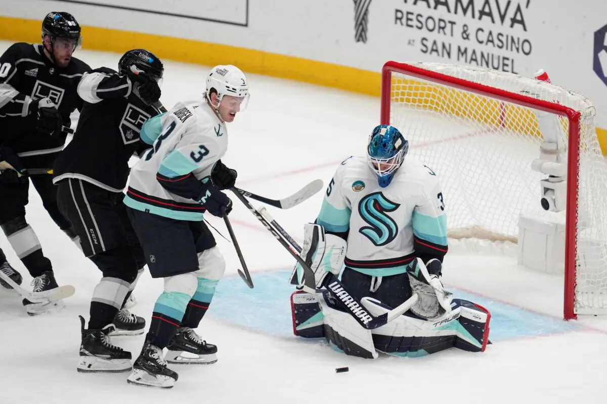 Seattle Kraken goaltender Joey Daccord (35) stops a shot during the second period of an NHL hockey game against the Los Angeles Kings in Los Angeles on Dec. 20, 2023. (Ashley Landis/AP Photo)