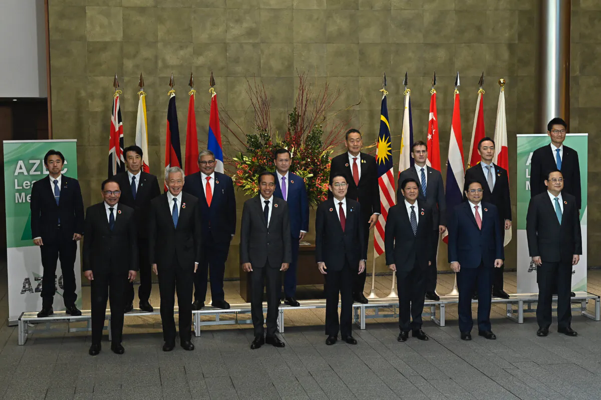 Japan's Prime Minister Fumio Kishida (front C) poses for a group photo with leaders of ASEAN-member nations and other participants prior to the Asian Zero Energy Carbon (AZEC) Summit, held in conjunction with the ASEAN-Japan commemorative summit, at the Japanese Prime Minister's office in Tokyo on Dec. 18, 2023. (David Mareuil / POOL / AFP via Getty Images)