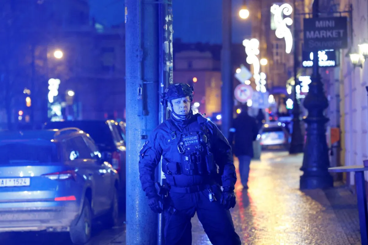 A police officer secures the area following the shooting at one of the buildings of Charles University in Prague on Dec. 21, 2023. (David W Cerny/Reuters)