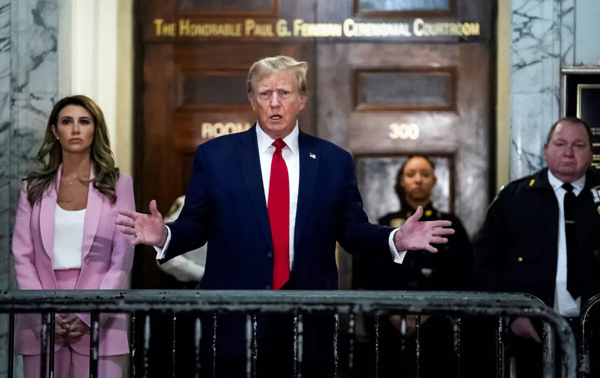 Former President Donald Trump speaks to members of the media as he arrives at the New York State Supreme Court during the civil fraud trial against the Trump Organization, in New York City, on Dec. 7, 2023. (Timothy A. Clary/AFP via Getty Images)