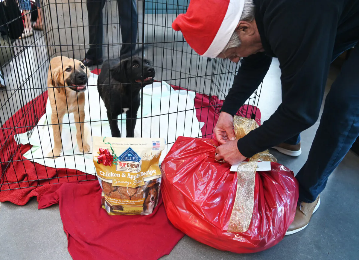Bob Cooper visits the Helen Woodward Animal Center with holiday treats in memory of his wife Karen. (Courtesy of Helen Woodward Animal Center)
