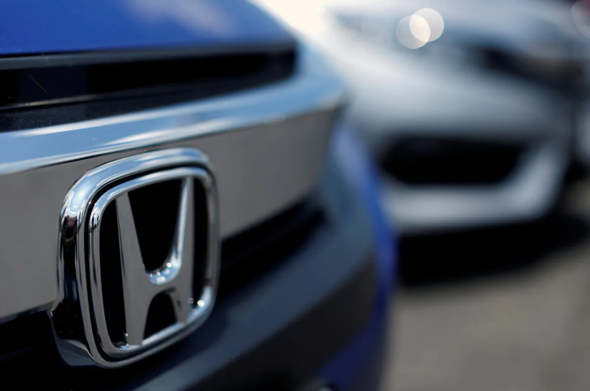 The Honda logo on a new Civic model on a dealer's lot in Silver Spring, Md., on June 1, 2016. (Gary Cameron/Reuters)