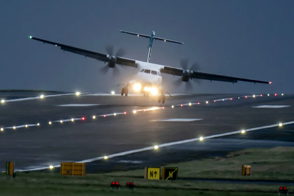A aircraft lands at Leeds Bradford Airport in England on Dec. 21, 2023. (Danny Lawson/PA via AP)