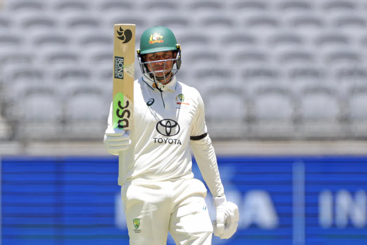 Usman Khawaja of Australia celebrates reaching his half century during Day 4 of the first Test match between Australia and Pakistan at Optus Stadium in Perth, Australia on Dec. 17, 2023. (AAP Image/Richard Wainwright)