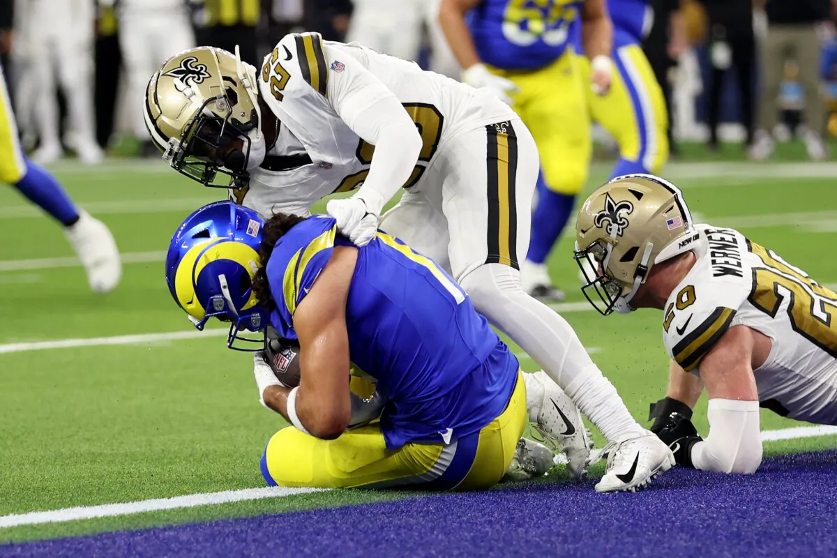 Puka Nacua (17) of the Los Angeles Rams scores a touchdown against Paulson Adebo (29) and Pete Werner (20) of the New Orleans Saints during the first quarter of the game at SoFi Stadium in Inglewood, Calif., on Dec. 21, 2023. (Sean M. Haffey/Getty Images)