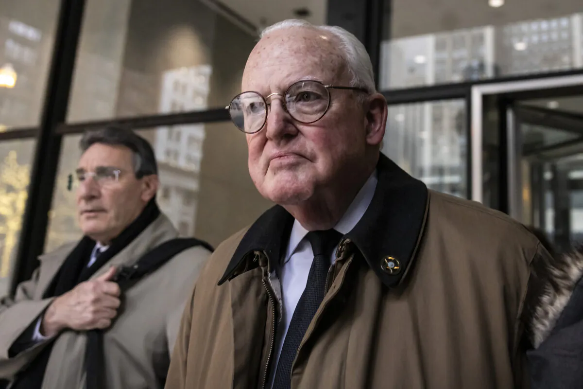 Flanked by family members and attorneys, former Ald. Edward Burke (14th) walks out of the Dirksen Federal Courthouse after being found guilty of racketeering, bribery, and attempted extortion, in Chicago on Dec. 21, 2023. (Ashlee Rezin/Chicago Sun-Times via AP)