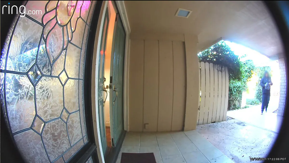 This Ring doorbell image shows an armed robber approaching Prince Riley's house in West Covina, California on Oct. 15, 2021. Mr. Riley has received legal services through the US Concealed Carry Association after he shot the robber. (Courtesy of Prince Riley)