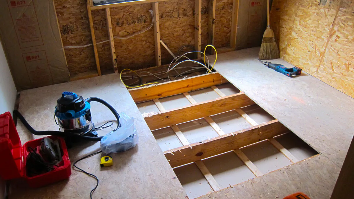 This unfinished space will soon become a man cave. Installing plumbing pipes, electric cables and other mechanics often requires floors to be opened up. (Tim Carter/Tribune Content Agency)