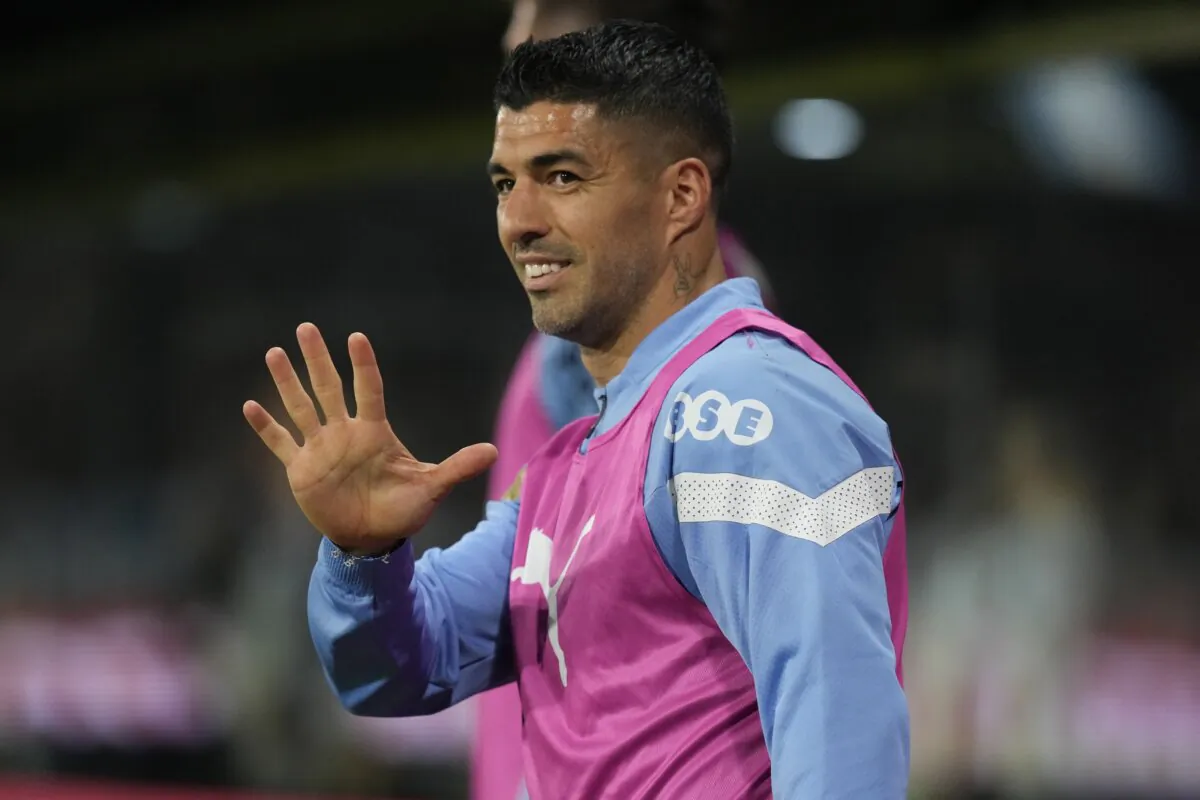 Uruguay's Luis Suarez waves from the bench during a qualifying soccer match for the FIFA World Cup 2026 against Argentina at La Bombonera stadium in Buenos Aires, Argentina, on Nov. 16, 2023. (Matias Delacroix/AP Photo)