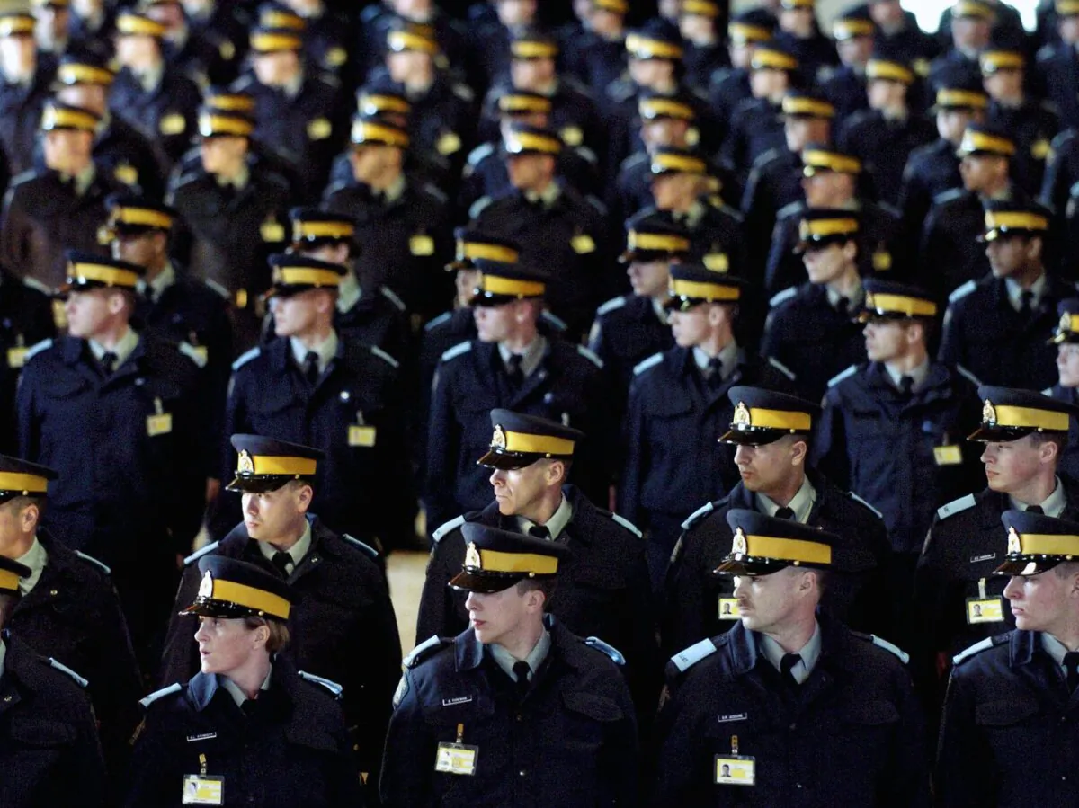 RCMP cadets attend daily marches at the Drill Hall at the RCMP headquarters in Regina, Sask. on Mar. 3, 2005. (The Canadian Press/Troy Fleece)