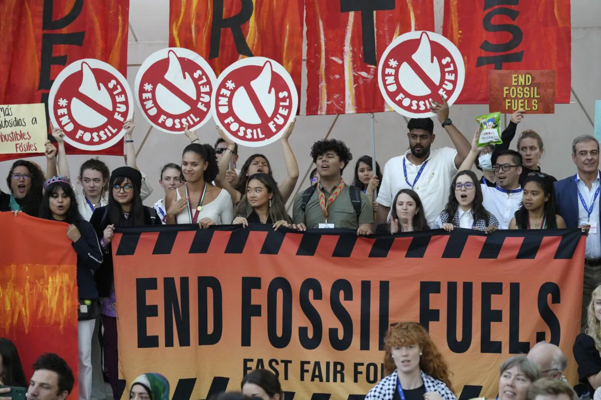 Activists participate in a demonstration against fossil fuels at the COP28 U.N. Climate Summit in Dubai, United Arab Emirates, on Dec. 12, 2023. (AP Photo/Peter Dejong)