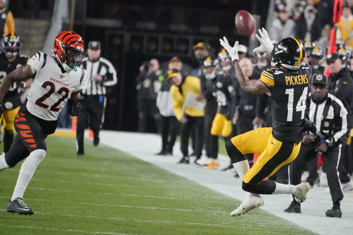 Pittsburgh Steelers wide receiver George Pickens (14) catches a pass as Cincinnati Bengals cornerback Chidobe Awuzie (22) moves in during the first half of an NFL football game in Pittsburgh on Dec. 23, 2023. (Gene J. Puskar/AP Photo)
