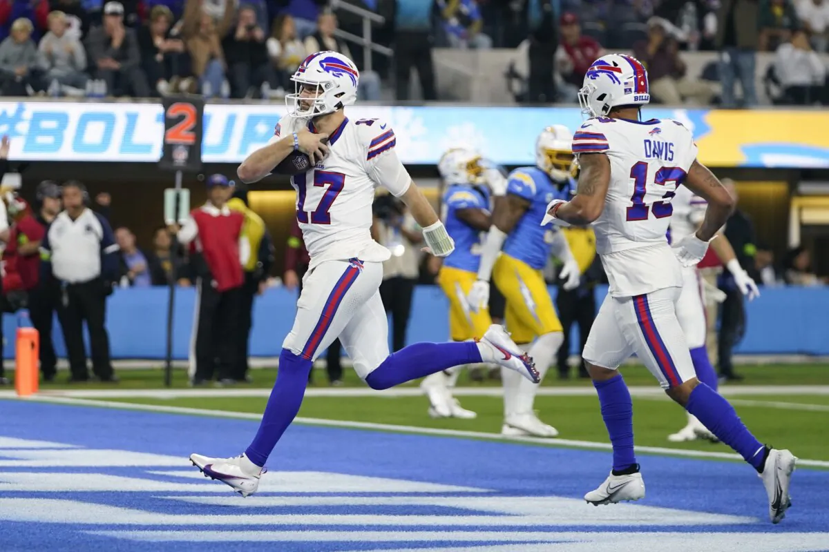 Buffalo Bills quarterback Josh Allen (17) scores a rushing touchdown during the first half of an NFL football game against the Los Angeles Chargers in Inglewood, Calif., on Dec. 23, 2023. (Ryan Sun/AP Photo)