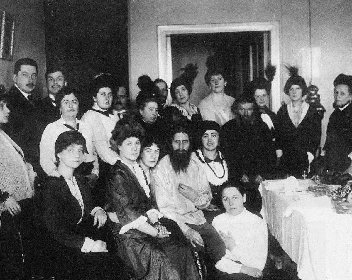 Russian mystic Grigori Rasputin (seated, centre) with his followers in 1914, two years before he was assassinated. (Public Domain)