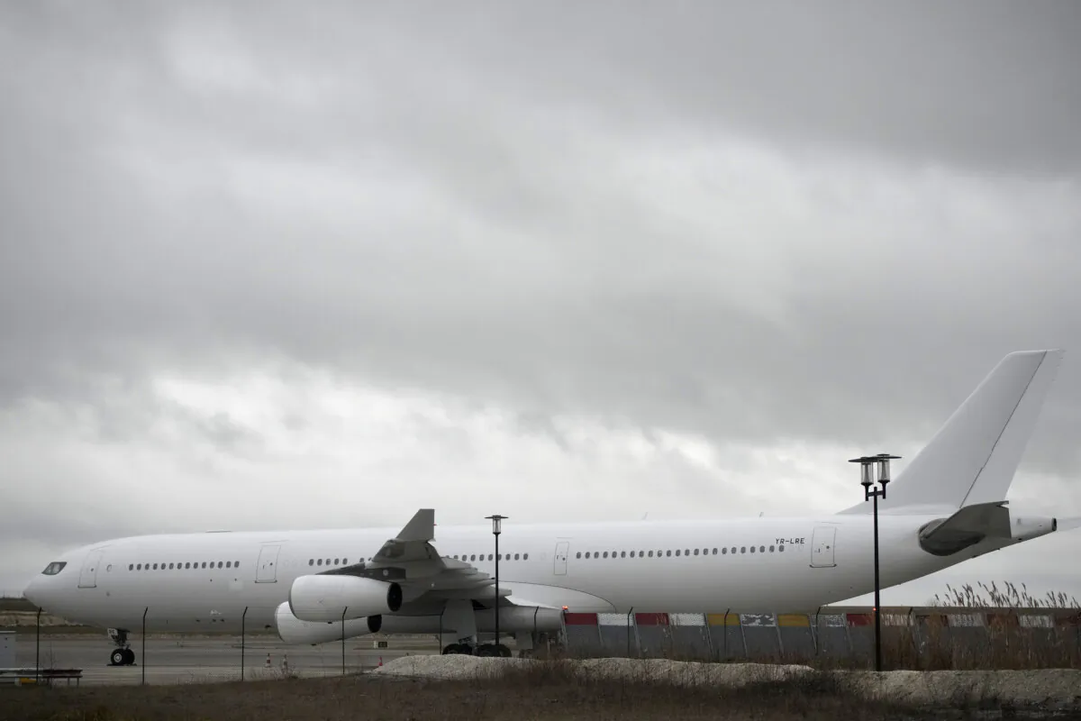 The plane reported to carry some 300 Indian citizens parks at the Vatry airport, eastern France, on Dec. 23, 2023. (Christophe Ena/AP Photo)