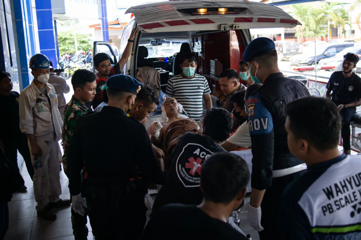 A Chinese worker who was injured in the explosion at a nickel smelter furnace is brought to the Morowali Regional General Hospital in Central Sulawesi, Indonesia, on Dec. 24, 2023. (STR/AFP via Getty Images)