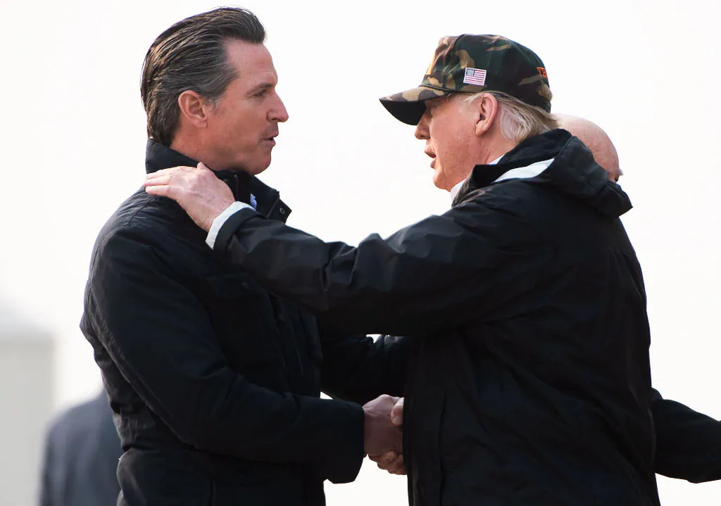 President Donald Trump greets California Governor-elect Gavin Newsom (L) as he disembarks from Air Force One upon arrival at Beale Air Force Base near Marysville, Calif., on Nov. 17, 2018. (Saul Loeb/AFP via Getty Images)