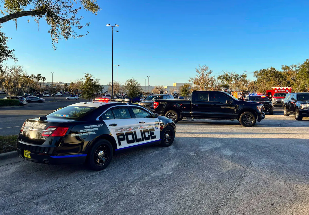 A cruiser sits parked following a fatal shooting at Paddock Mall in Ocala, Fla., on Dec. 23, 2023. (Jeff Walczak/Ocala Police Department via AP)
