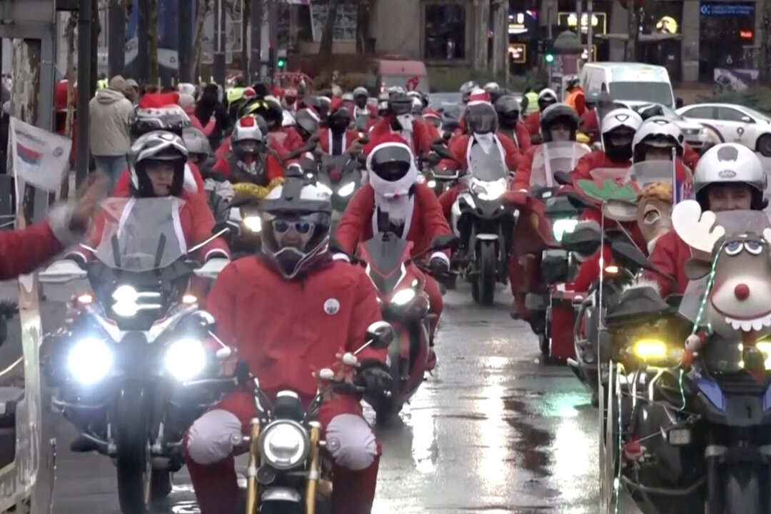 Motorcycle Riders Dressed in Santa Costumes Bring Joy to Children in