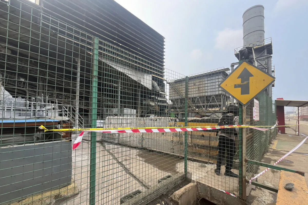 A police officer stands guard near the site where a furnace explosion occurred at PT Indonesia Tsingshan Stainless Steel smelting plant in Morowali, Central Sulawesi, Indonesia, on Dec. 24, 2023. (AP Photo)
