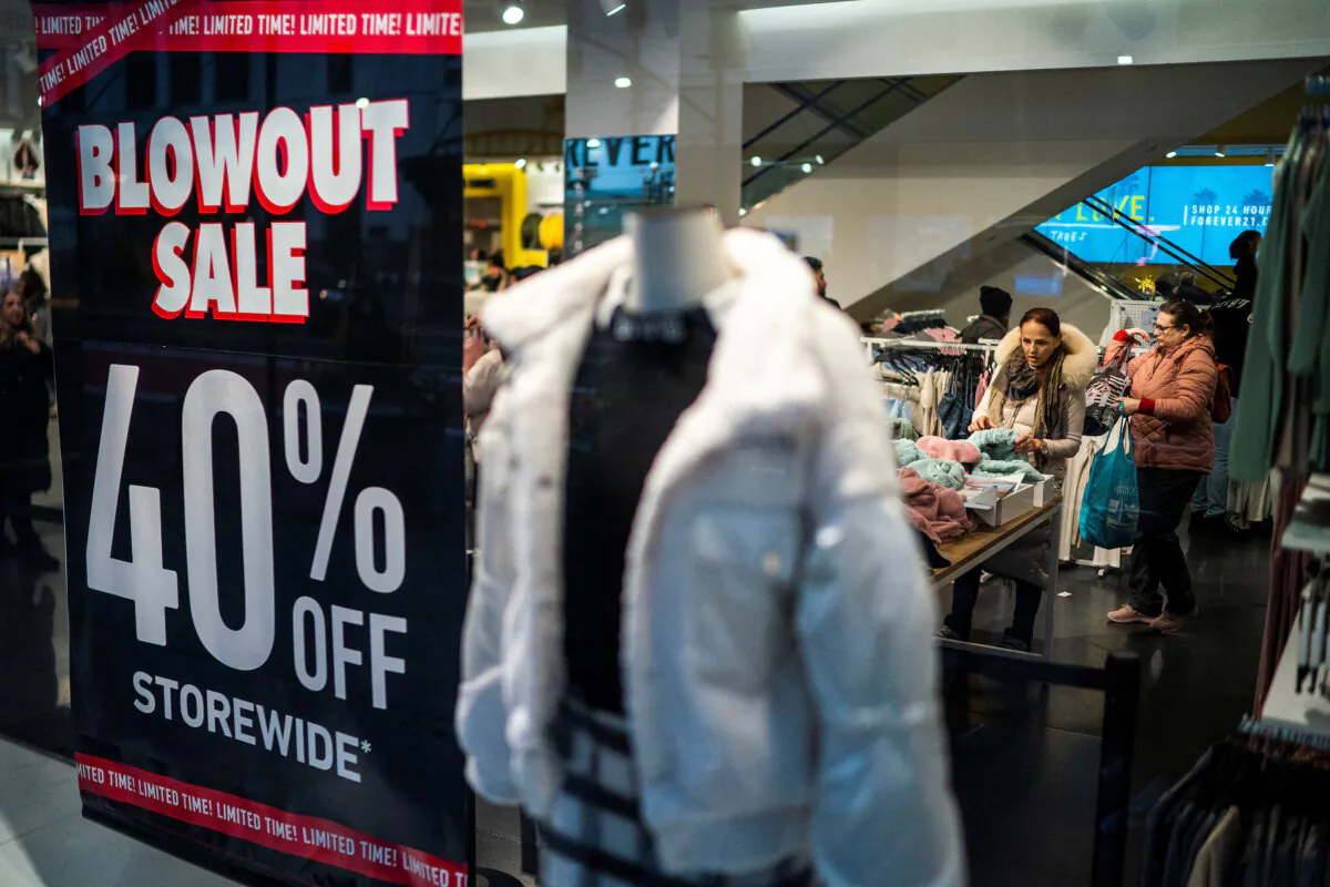People look for discounts in a local store in New York on Dec. 25, 2023. (Eduardo Munoz/Reuters)