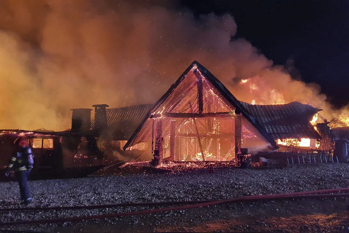 A guesthouse is in flames in Tohani, Romania, on Dec. 26, 2023. (Romanian Emergency Services/ISU Prahova via AP)