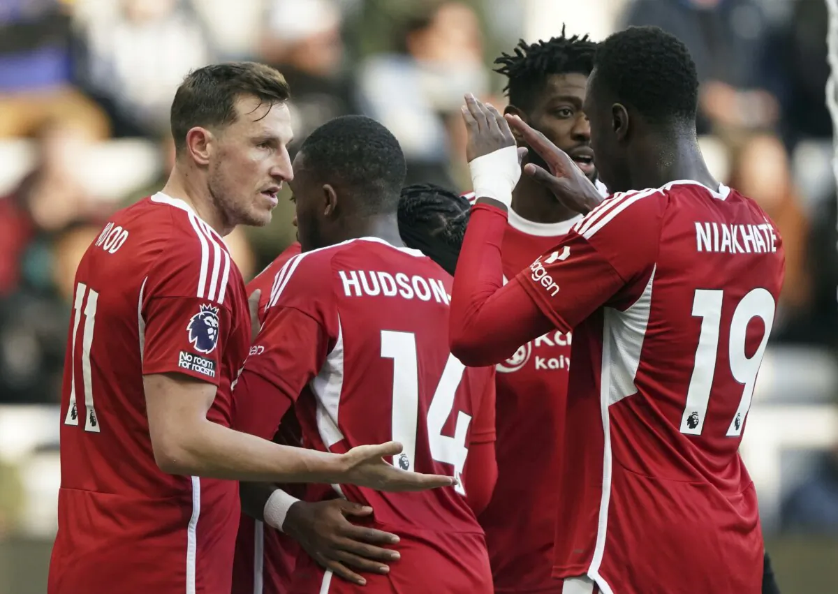 Nottingham Forest's Chris Wood (L) celebrates scoring his side's first goal during the English Premier League soccer match between Newcastle United and Nottingham Forest at St. James' Park, Newcastle upon Tyne, England, on Dec. 26, 2023. (Owen Humphreys/PA via AP)