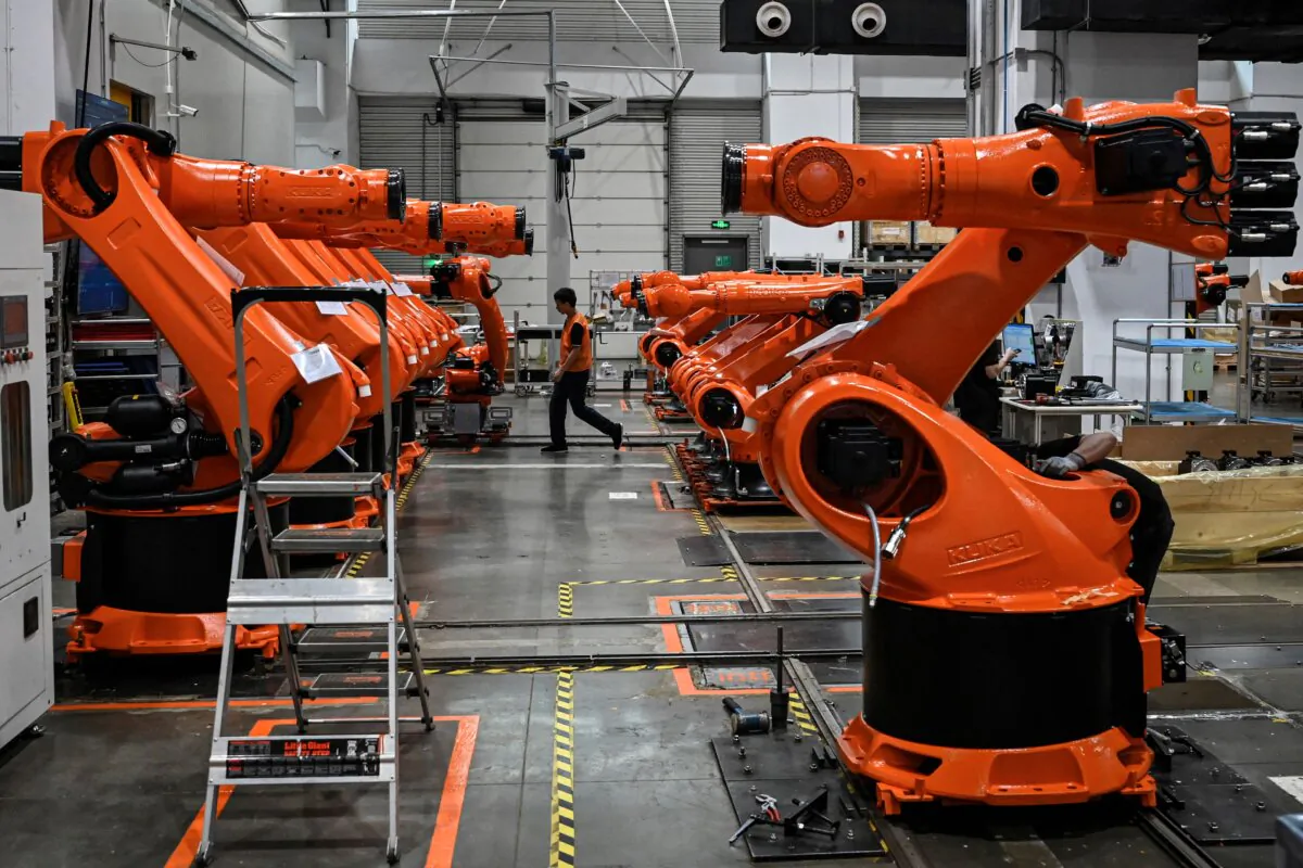 Robotic arms made by industrial robot manufacturer KUKA at its factory owned by Chinese home appliances giant Midea Group in Foshan, in China's southern Guangdong Province, on July 7, 2022. (Jade Gao/AFP via Getty Images)